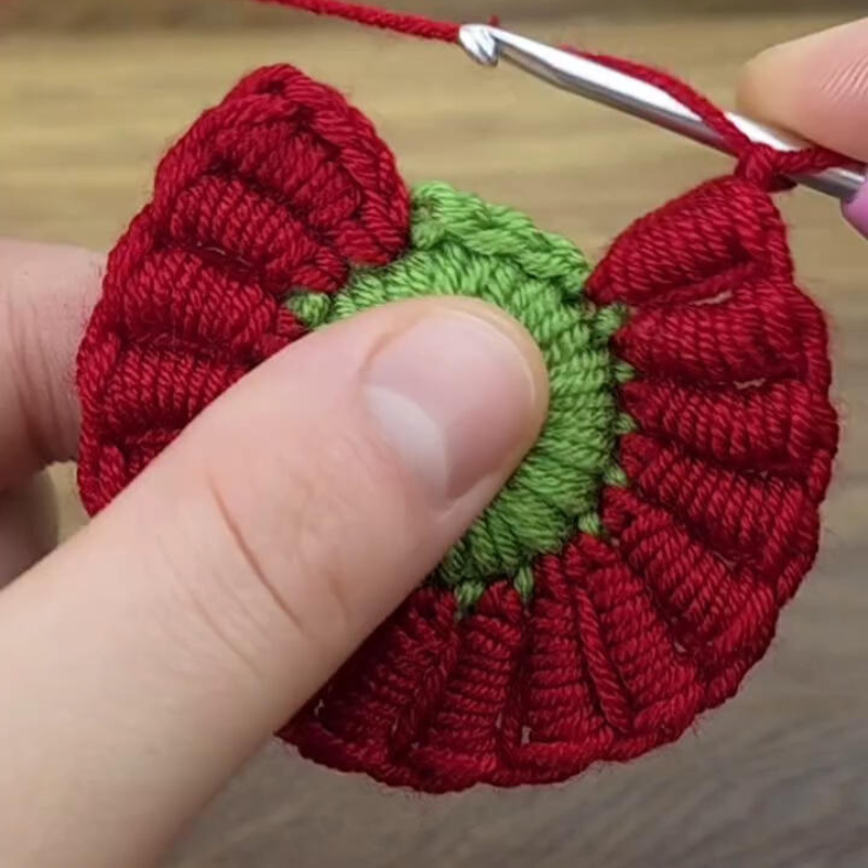 crochet hook with red yarn